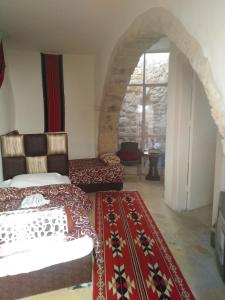 a living room with a couch and a table at Dana Tower Hotel in Dana