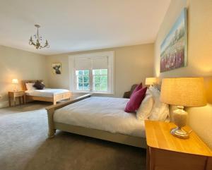 a bedroom with a large bed and a couch at Bailey's Court, Guest Accommodation in Portadown