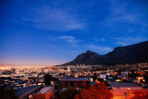 a view of a city with a mountain in the background at Radium Hall Guest House in Cape Town