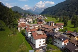 an aerial view of a village in the mountains at Condominio Le Coste in Falcade