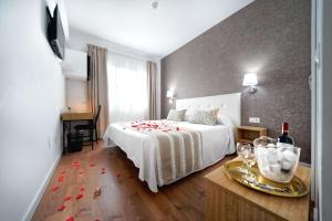 A bed or beds in a room at Hotel Matilde by Grupo Matilde