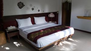 A bed or beds in a room at 池上福吉園素食民宿 臺東縣民宿073號 請勿透過阿勾達訂房