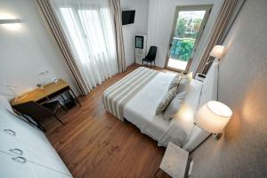 A bed or beds in a room at Hotel Matilde by Grupo Matilde