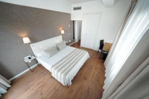 A bed or beds in a room at Hotel Matilde by Grupo Matilde
