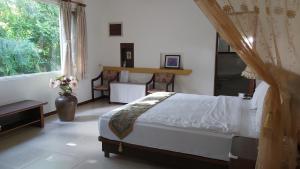 A bed or beds in a room at 池上福吉園素食民宿 臺東縣民宿073號 請勿透過阿勾達訂房