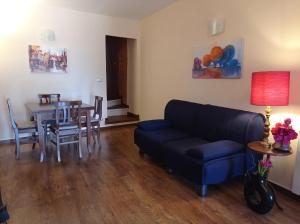 a living room with a couch and a table at Casetta Angie in Barrea