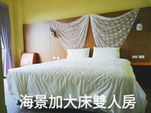 Voodi või voodid majutusasutuse 海旺子海景民宿 toas