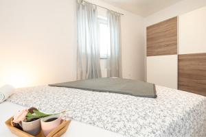 Postel nebo postele na pokoji v ubytování Apartments Doris, Krk