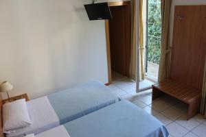 Posteľ alebo postele v izbe v ubytovaní Albergo Hofer