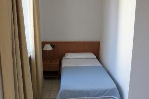 Posteľ alebo postele v izbe v ubytovaní Albergo Hofer