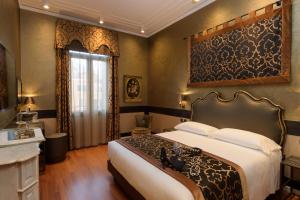 Postel nebo postele na pokoji v ubytování UNAHOTELS Ala Venezia-Adults 16