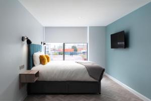 Ένα ή περισσότερα κρεβάτια σε δωμάτιο στο Aptel East