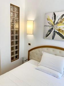 Postel nebo postele na pokoji v ubytování Hotel Regina Margherita