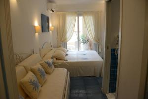 Posteľ alebo postele v izbe v ubytovaní Janas Hotel