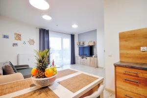 Televízia a/alebo spoločenská miestnosť v ubytovaní SPA Polanki PARK Nemo Apartamenty Kołobrzeg