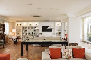 a living room with a pool table in it at M'AR De AR Muralhas in Évora