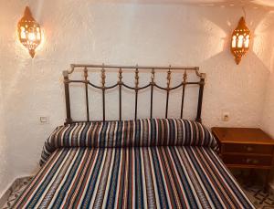 En eller flere senge i et værelse på Cueva La Ermita II