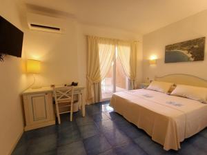 Posteľ alebo postele v izbe v ubytovaní Janas Hotel