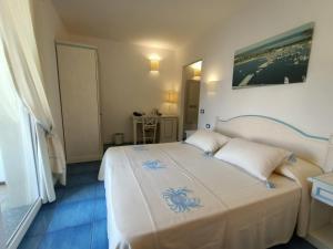 Posteľ alebo postele v izbe v ubytovaní Janas Hotel