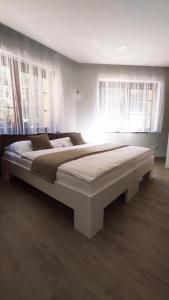 Postel nebo postele na pokoji v ubytování Apartmány Na Vyhlídce
