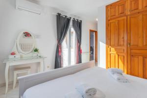 Postel nebo postele na pokoji v ubytování Villa Rosa