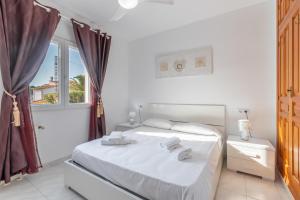 Postel nebo postele na pokoji v ubytování Villa Rosa