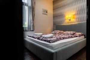 Postel nebo postele na pokoji v ubytování Allium Apartment