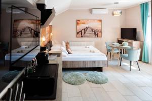 Postel nebo postele na pokoji v ubytování Allium Apartment