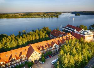 an aerial view of a resort on a lake at Hotel Robert's Port in Mikołajki