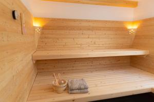 a wooden sauna with a bench in a room at Ferienhaus Schilcherland in Hochneuberg