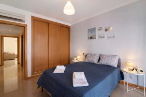 Postel nebo postele na pokoji v ubytování Apartamento Água Brisa + 21 fotografií