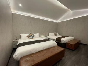 Letto o letti in una camera di 弎TRINITY