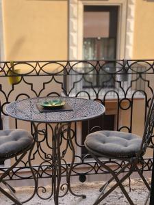a table and chairs with a plate on top of it at DENEB 19 Apartment in Verona +41 photos