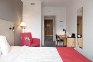 Postel nebo postele na pokoji v ubytování Hotel Bishops Arms Strängnäs
