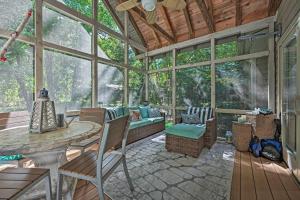 a conservatory with a room with a large window at Luxury Family Home with Deck, Swim Spa and Grill! in New Buffalo