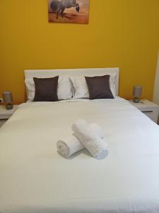 Postel nebo postele na pokoji v ubytování APARTMAN SUNFLOWER