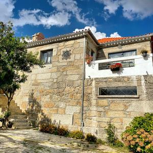 a stone building with stairs in front of it at Quinta da Corga in Prova +16 photos