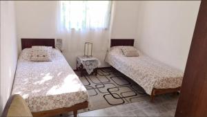 Postel nebo postele na pokoji v ubytování Preciosa casa en la tranquilidad de Colonia Relájate con toda la familia donde la tranquilidad se respira - A una cuadra de la mejor zona de la rambla de Colonia del Sacramento te espera esta casa para pasar las vacaciones en familia