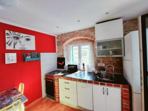 Kuchyň nebo kuchyňský kout v ubytování Apartment Lucy Lu