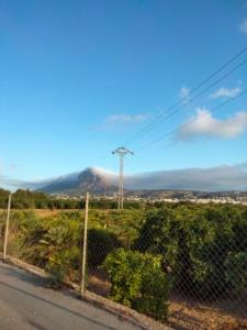 a view of a mountain from the road at maison nathalia in Jávea