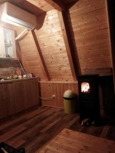a room with a wood stove in a attic at The view in Bijelo Polje