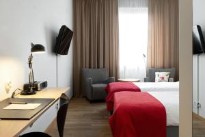 Postel nebo postele na pokoji v ubytování Hotel Bishops Arms Strängnäs