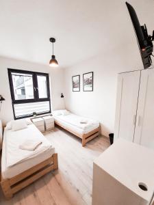 Posteľ alebo postele v izbe v ubytovaní Apartament Kraków Arena No. 100