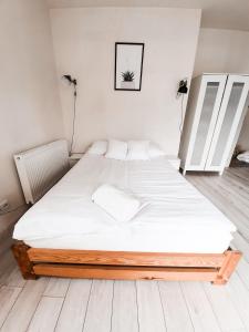 Posteľ alebo postele v izbe v ubytovaní Apartament Kraków Arena