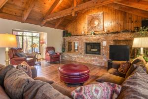 a living room with a couch and a fireplace at Skyland Retreat - Max nighttime occupancy of 8 in Zephyr Cove