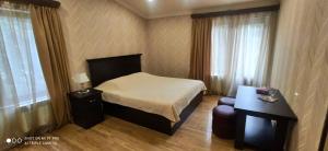 Voodi või voodid majutusasutuse Ruzan hotel toas