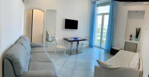 a living room with a couch and a table at Sorrento Flats in Sorrento
