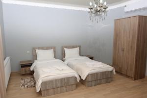 Postel nebo postele na pokoji v ubytování Hotel Shogi