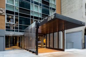 a building with a sign on the front of it at Henn na Hotel New York in New York