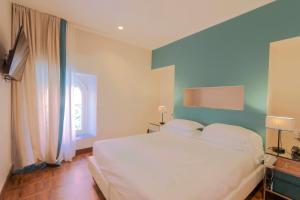 Hotel Villa Alberti Portofino Land客房内的一张或多张床位